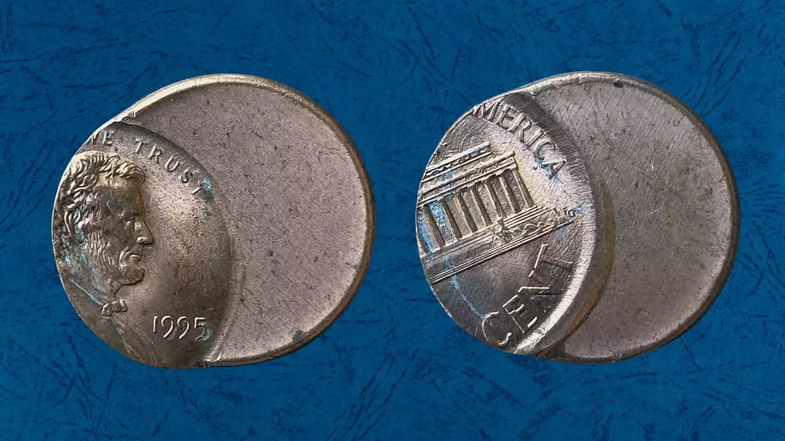 1995 Lincoln penny off-center strike error showing shifted design and blank planchet crescent